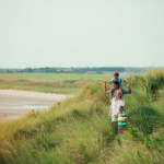 Family Walking Through the Sand Dunes