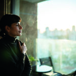 Young woman contemplating at home